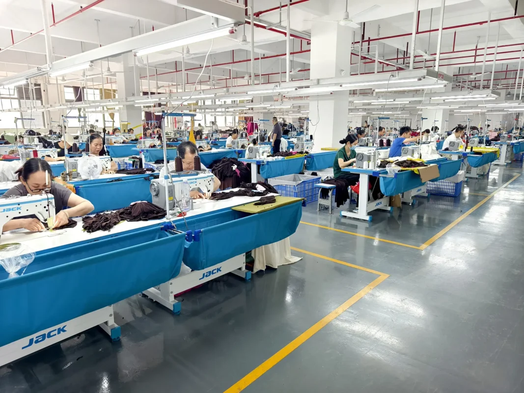 Garment operators working at industrial sewing stations