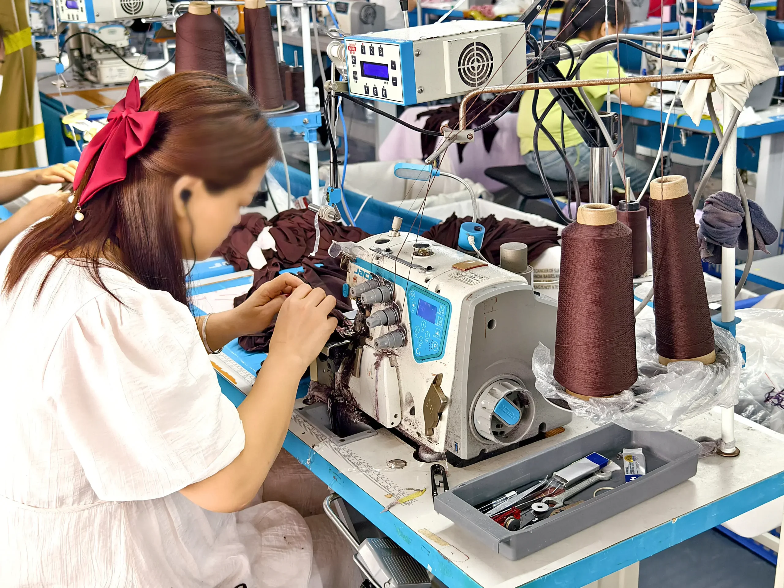 Overseas buyer inspecting BSCI-compliant production line in Dongguan