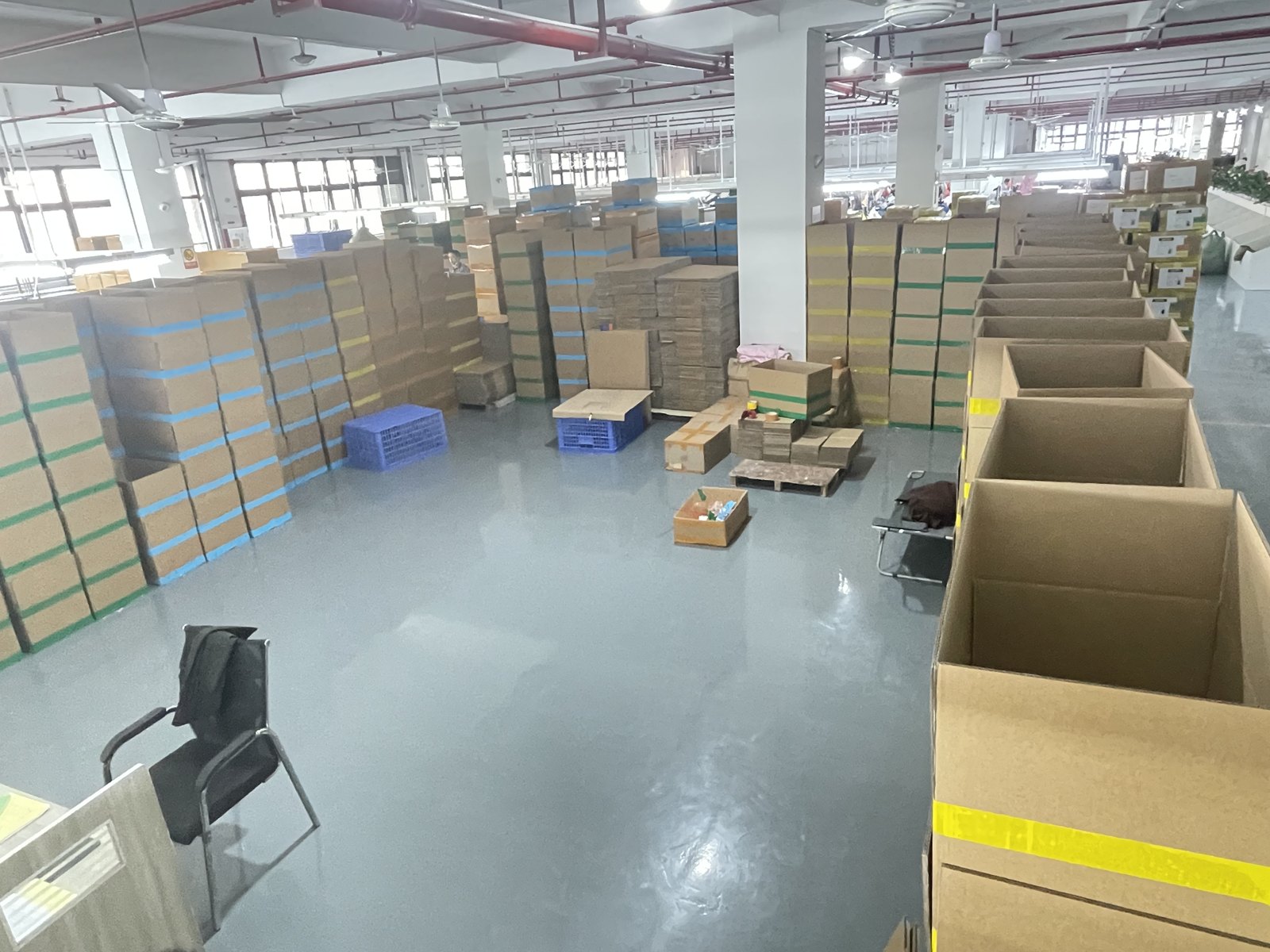 Packed cartons stored in the factory storage area.